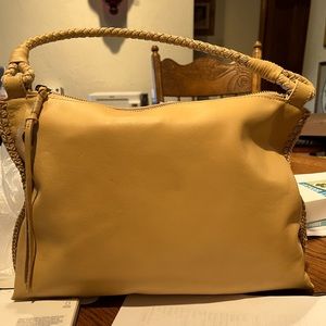 The Sak bag/purse. Has a small pen mark on back. Used once.